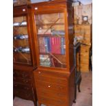 A Georgian style chest of drawers with brushing sl