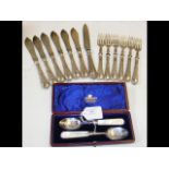 A cased set of silver spoons, together with fish k