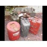 Six old Jerry cans together with an old Esso can
