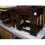 A nest of three oak occasional tables