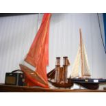 Three model sailing boats and a vintage Roberts Ra