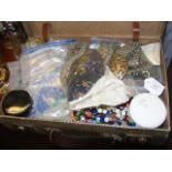 A small suitcase containing costume jewellery incl