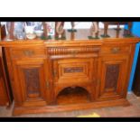 An Edwardian sideboard with break front and decora