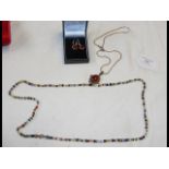 A carnelian and silver drop on chain, together wit