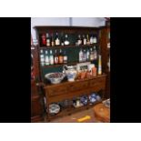 An oak dresser, consisting of two shelves above th