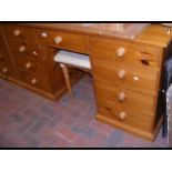 A pine knee-hole dressing table with mirror to bac