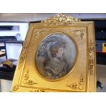 An elegant oval portrait miniature of lady in deco