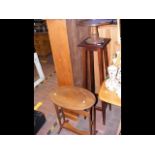 A mahogany pot stand together with a lazy susan an