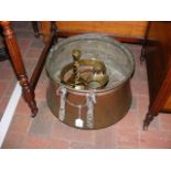 A brass cauldron together with other brassware