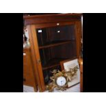 A corner cabinet with glazed door together with a