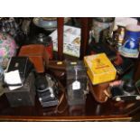A collection of vintage cameras including Pentax