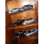 Six model cars including a Kyosho BMW 7 series