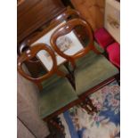 A set of four Victorian mahogany balloon back chai