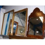 Two gilt framed wall mirrors and a wood framed wal