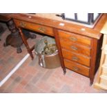 A walnut knee-hole desk, inset leather top, five d