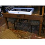 An oak kitchen table with single drawer