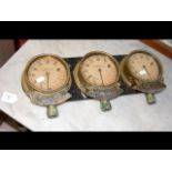 A set of three old pressure gauges from a ship's t