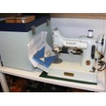 A 1960s white 'pale turquoise' Singer Featherweight 221k sewing machine in original case