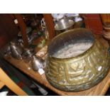 An Islamic brass cauldron together with plated war