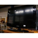 A Samsung 25 inch flatscreen TV with remote