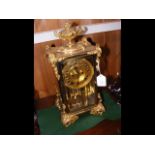 An elegant ormolu four glass mantel clock - 38cm h