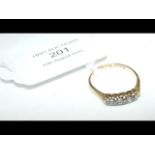 A five stone diamond ring in 18ct gold setting