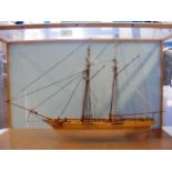 A wooden model two masted boat in glazed display c