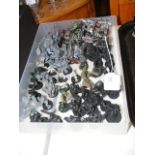 A cluster of assembled Games Workshop Warhammer 40000 Ork and Goblin miniatures - painted to varying