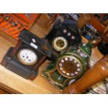 Two black slate Victorian mantel clocks together w