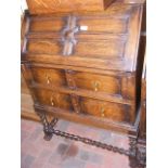 A 1920's Jacobean style bureau with barley twist s