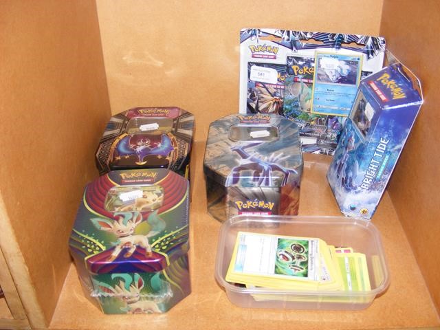 A collection of Pokemon trading cards, some boxed,