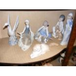 Four Lladro figures including a boy with dog, toge