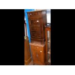 A French oak bedside cabinet with rouge marble top