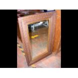 An oak framed wall mirror