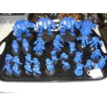 A cluster of assembled Games Workshop Warhammer 40000 Space Marines miniatures, including a land spe