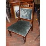 A Victorian walnut framed ladies chair on turned l