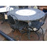 A circular metal garden table - 120cm diameter - w