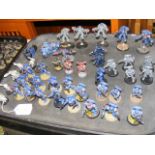 A cluster of assembled Games Workshop Warhammer 40000 Space Marines miniatures, including ultra mari