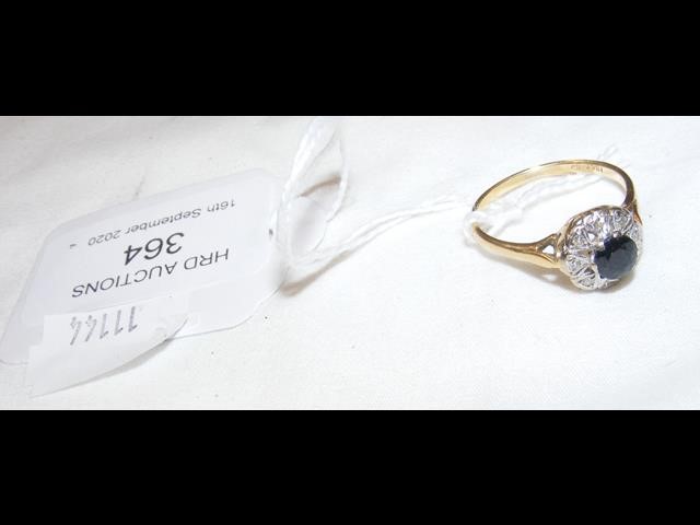 An 18ct gold sapphire and diamond ring