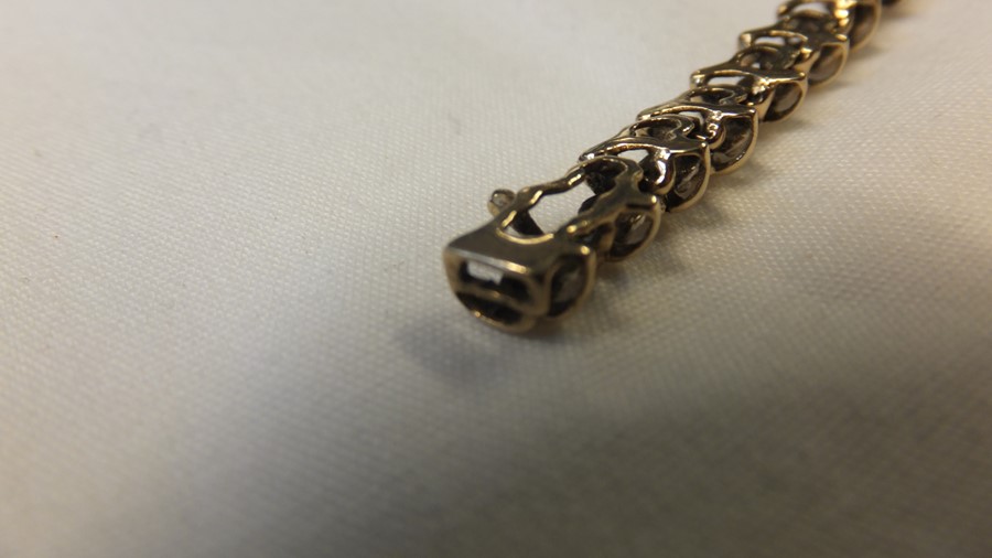 A 9ct gold diamond mounted 'Tennis' bracelet - Image 4 of 6