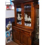 A Victorian style reproduction bookcase with glaze