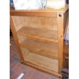 A pine open bookcase - width 83cms