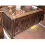 A period oak coffer with panelled front