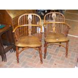 A pair of 19th century yew wood country armchairs with crinoline str