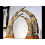 Two pairs of decorative carved horns