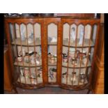 A walnut display cabinet with two bow doors - 120c