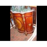 A French style serpentine fronted cabinet with mar