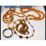 A box of amber beads, together with amber bracelet