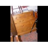 An antique pine chest of two short and three long