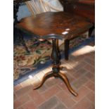 A 19th century occasional table on tripod support